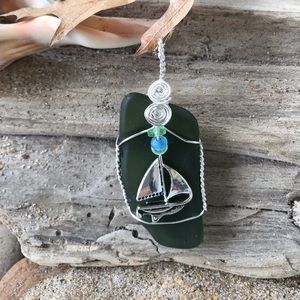 Green sea glass wire wrapped sailboat necklace